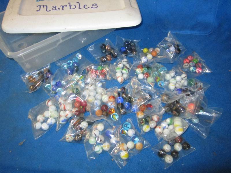 lot 70 image: Plastic tub of marbles...