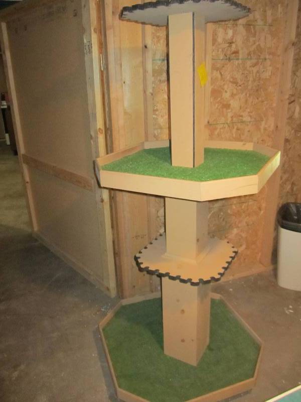 lot 27 image: Golf club display on caster wheels....