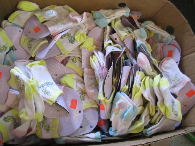 lot 119 image: Bananna box of baby socks great val...