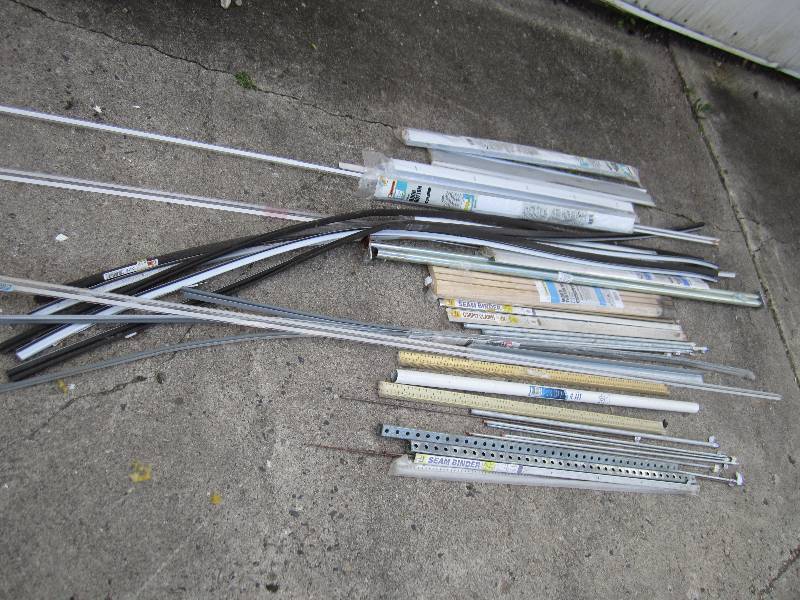 lot 138 image: lot of floor transitions metal rods...