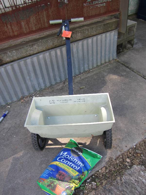 lot 176 image: spreader and pottong soil...