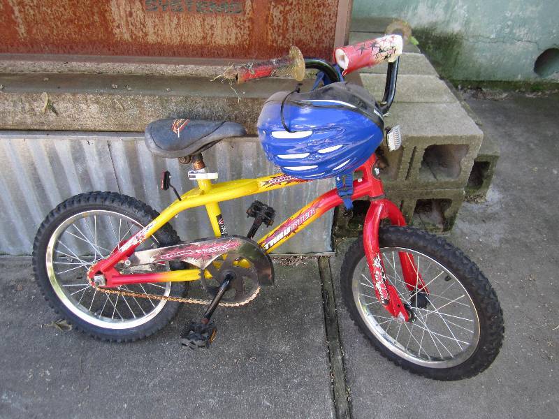 lot 185 image: Bike with helmet kid size needs new...