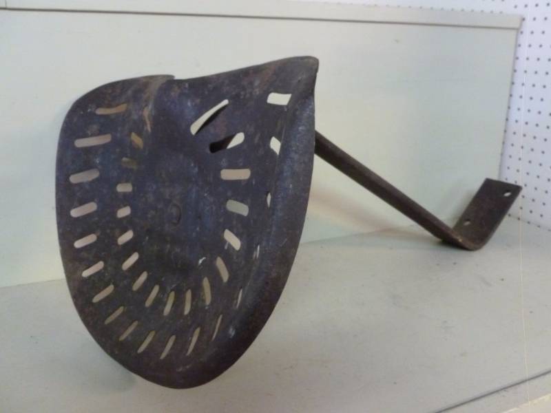 lot 12 image: Antique Tractor Seat