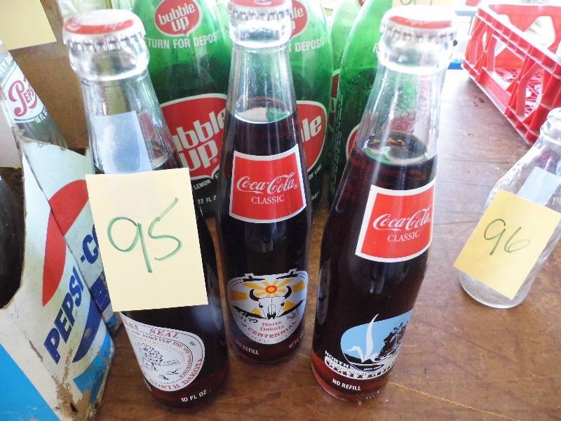 lot 95 image: 3 Centennial Coke Bottles