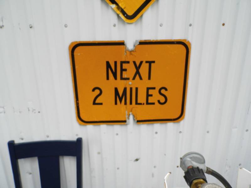 lot 311 image: Next 2 Miles Sign