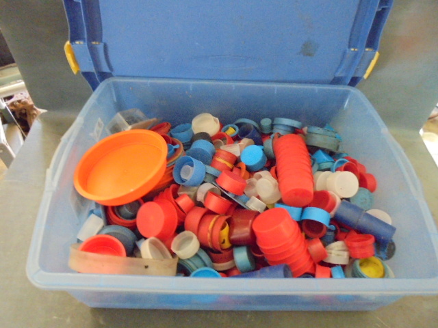 Dust Caps In A 30 Qt Rubbermaid Container