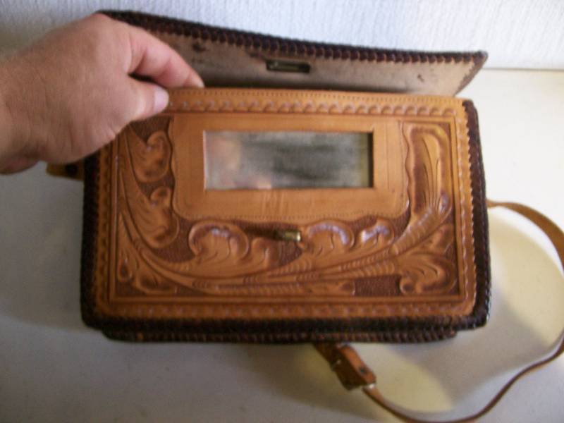 lot 18 image: Leather purse and vintage mirror