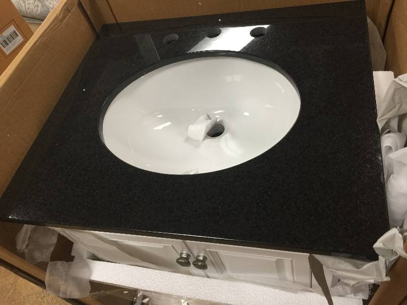 lot 4 image: Moorpark 25 in. Vanity in White with Granite Vanity Top in Black New