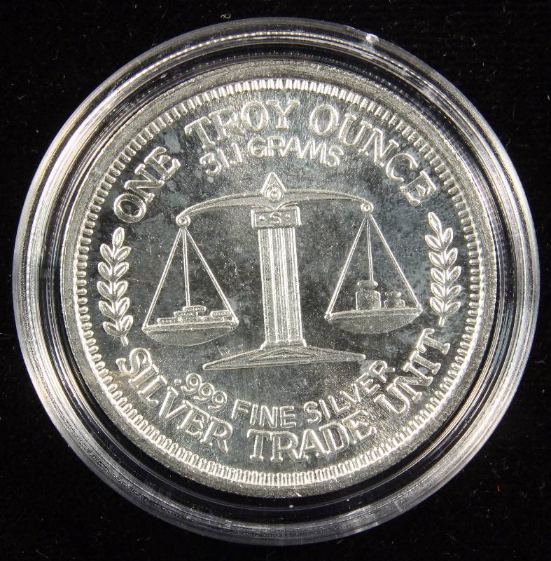 1 TROY OZ. .999 FINE SILVER 1984 MORGAN DOLLAR DESIGN IN AIRTITE HOLDER