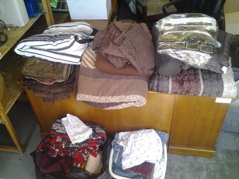 lot 29 image: Large Lot Of Bedding, Sheets, Comforters, Blankets, Pillow Shams, Bed Skirts, Laundry Basket & More