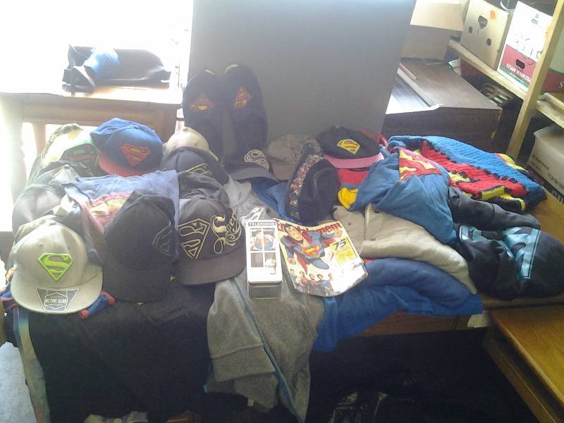 lot 42 image: Huge Lot Of Superman T-Shirts & Hoodies Size L, Caps, Afghan, More (38 Pieces In All)