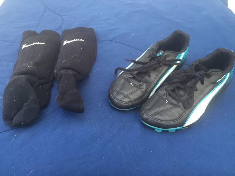 lot 103 image: Boy Puma Cleats and Nike Shin Guards