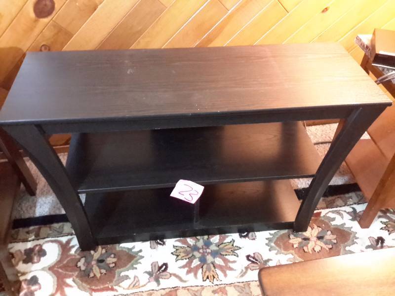 lot 23 image: Television Stand.. Solid wood.. Stained Black.