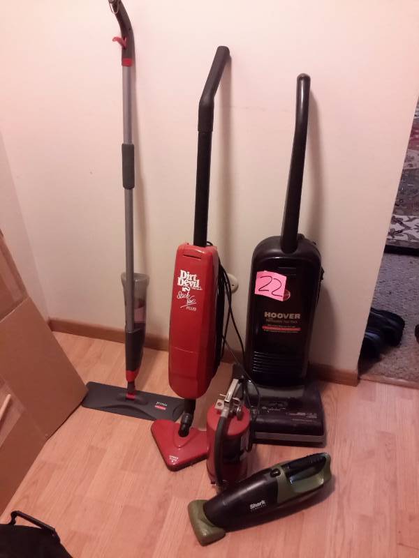 lot 22 image: 4 vacuums as shown, plus Fire Extinguishers