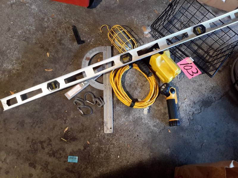 lot 103 image: Misc. Tools.. Including 48 in long level, 2 car blocks, Rolling seat, square, other items as pictured.