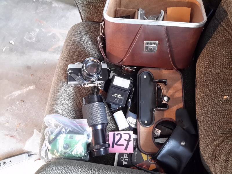 lot 127 image: Minolta XD 11 35MM Camera, Flash, Lense Case and small Vivitar camera.  Untested