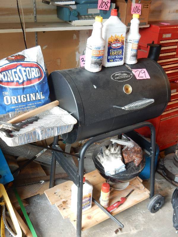 lot 29 image: MasterBuilt Charcoal Grill.. Little Smoky type of Grill.. Lots of accessories and products included.. See closeup pictures