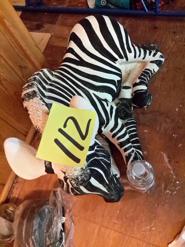 lot 112 image: Very large ZEBRA, Plaster Cast Statue.  See water bottle for size perspective.. Seems it needs some finishing to the painting.