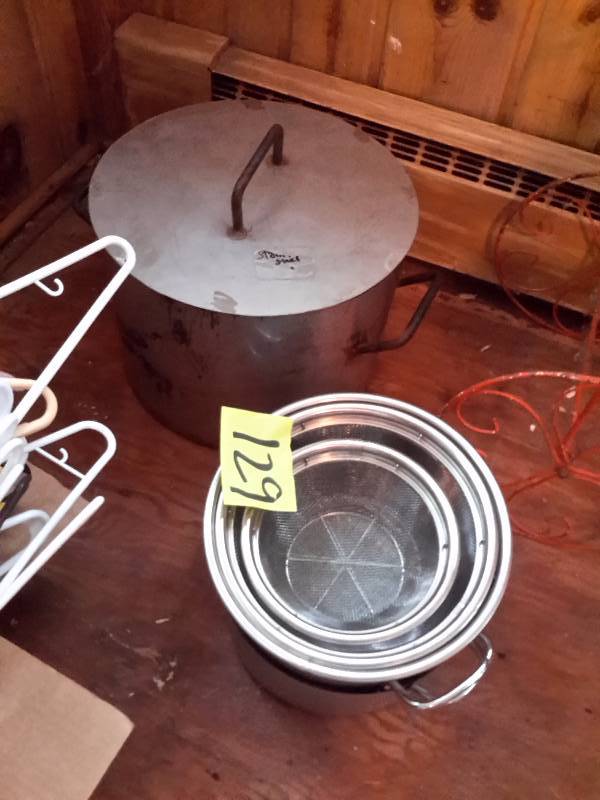 lot 129 image: LARGE Steel Cook pot and cover. 2 smaller cook pots.  3, strainers