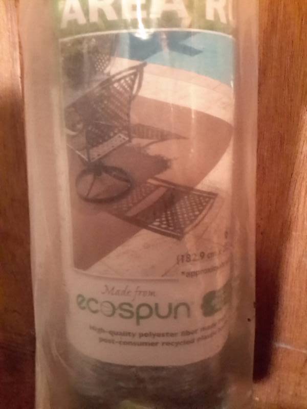 lot 147 image: 6ft x 8ft ECO SPUN material Rug.. New in package