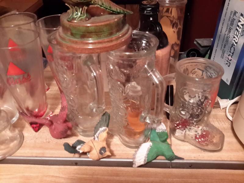 lot 155 image: Misc. Bar items, Glasses. BASS Glasses, 6 ABSOLUT Bloody Mary glasses, Guinnness Glasses,  boot shaped glasses, NEW, Buffet Server Frying pan with stand and burner.. Bring your own box for packing.