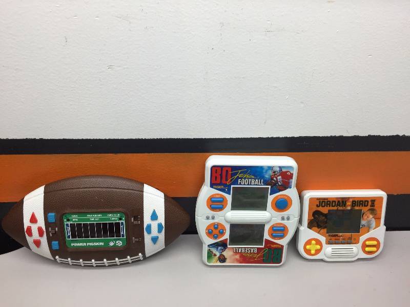 lot 7 image: HAND HELD ELECTRONIC GAMES, DEMOCRAT PINS AND STICKERS