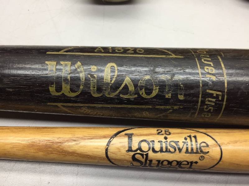 lot 12 image: SPORTING GOODS, BASEBALL GLOVES AND BATS, FOOTBALL HELMET, DUFFLE BAG, CATCHERS PADS