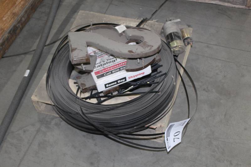 lot 70 image: Pallet Lot Including Serated Coiled Metal Band, Wall Decorations, Small Motor