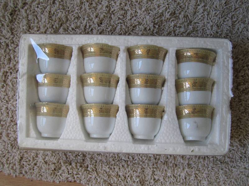 set of 12 small tea cups with decor...