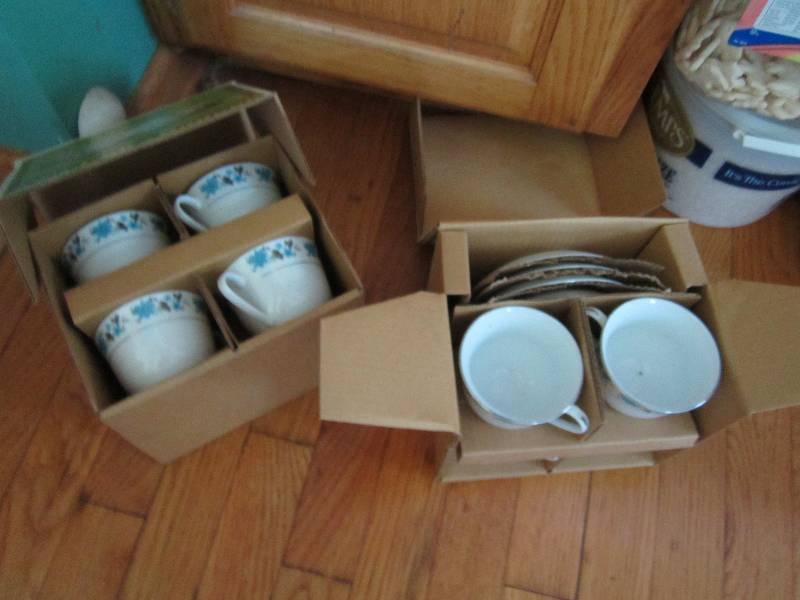 2 sets of 4 tea cups and saucers...