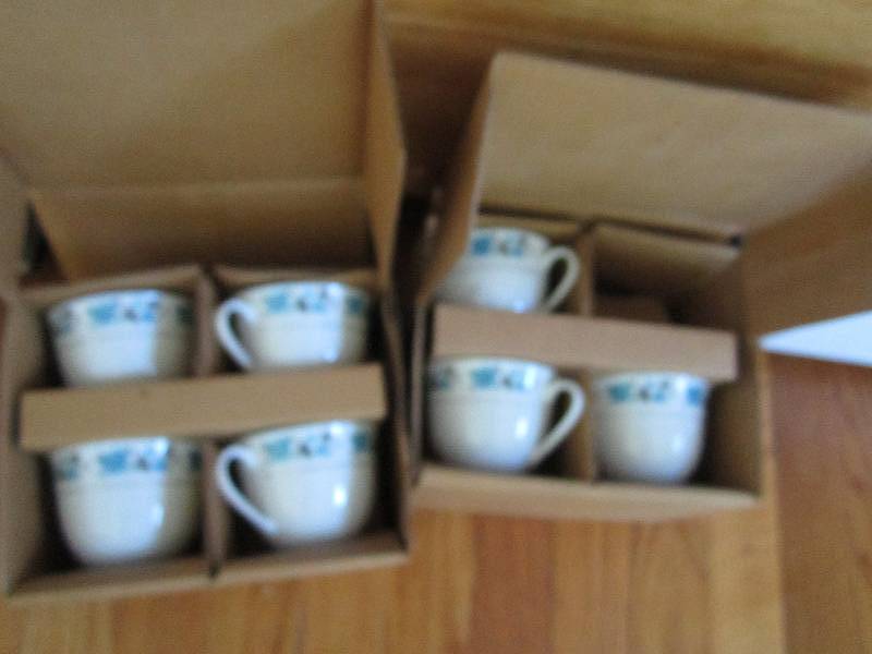2 sets of 4 cups and saucers...