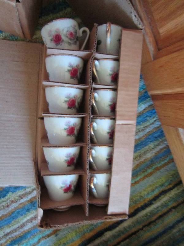 2 sets of floral tea cups and match...