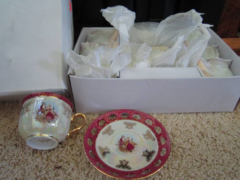 Set of six tea cups and matching sa...