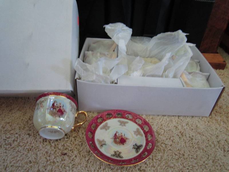 Set of six tea cups and matching sa...