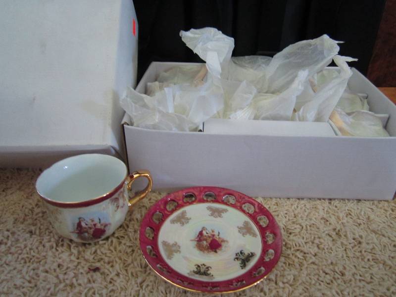 Set of six tea cups and matching sa...