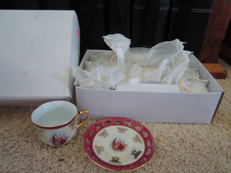 Set of six tea cups and matching sa...