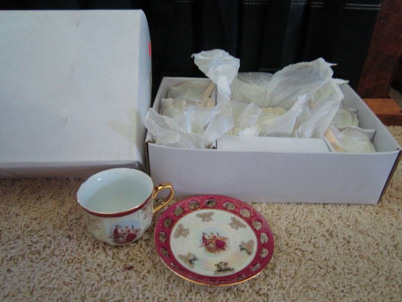 Set of six tea cups and matching sa...