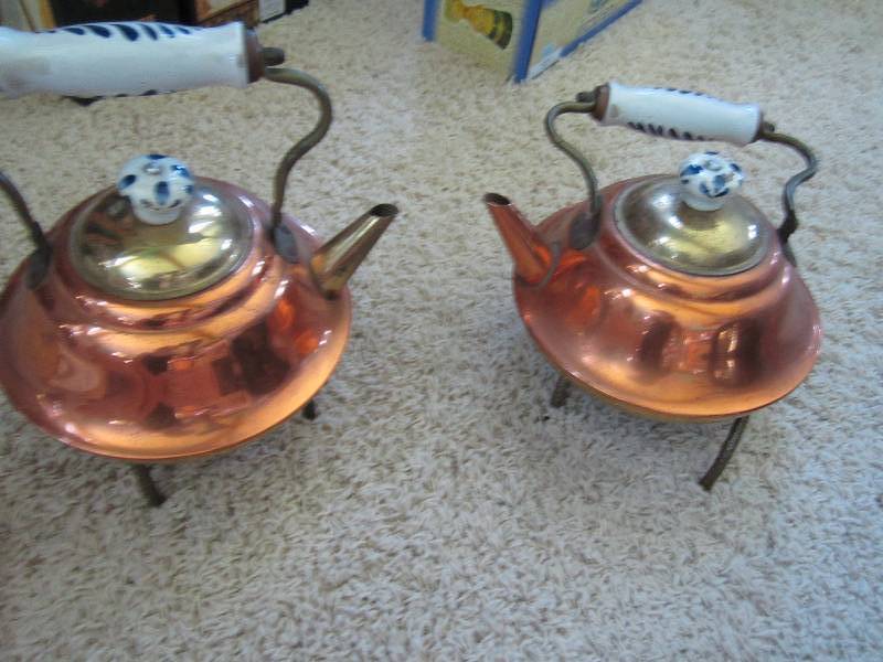 3 vintage kettles with cooling stan...