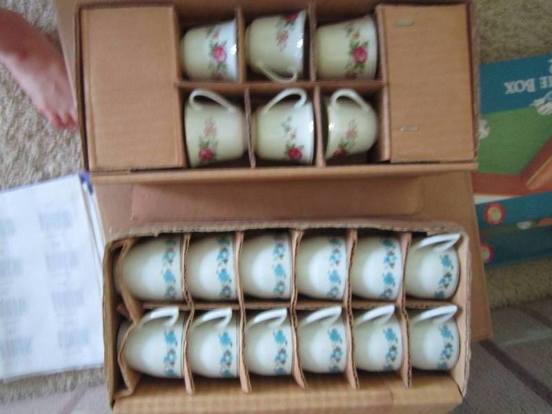 2 different sets of tea cupsand sau...
