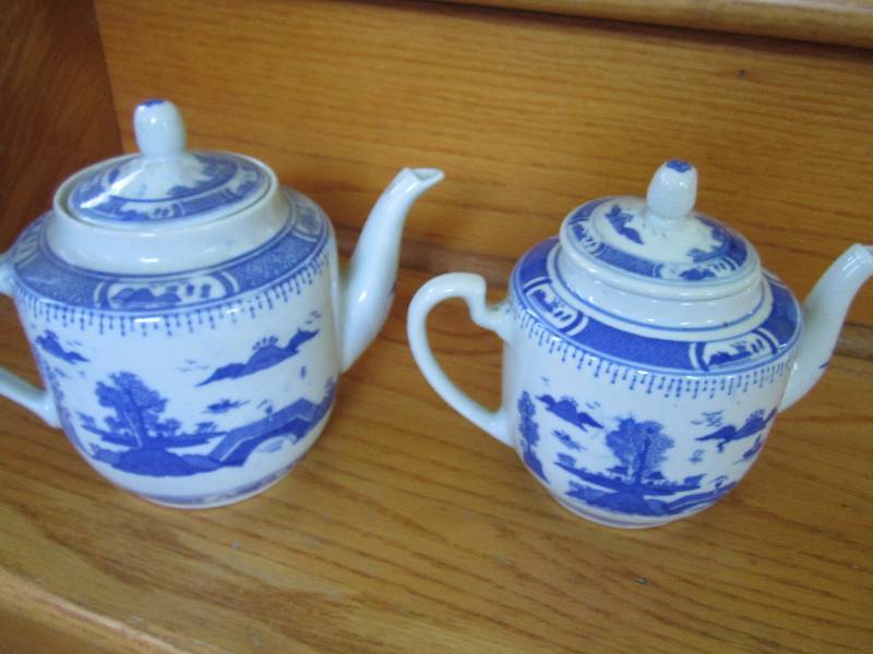 2 matching tea pots with decorative...