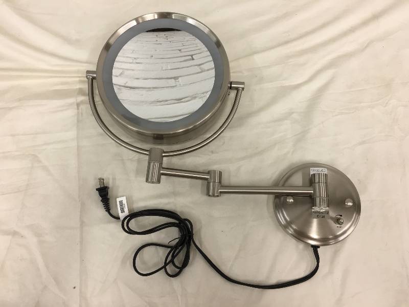 lot 27 image: Conair Double Sided Lighted 8X Magnification Fog-Free Wall Mount Mirror