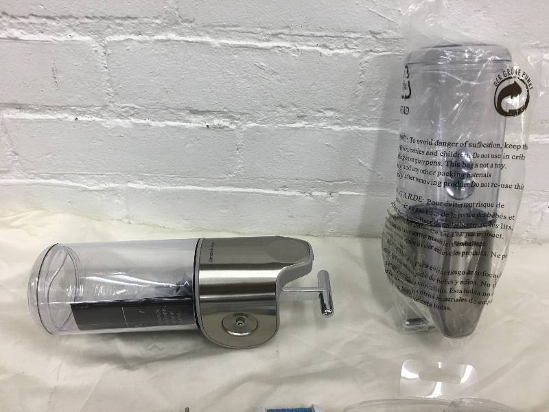lot 140 image: pedi egg scrubber and 2 simply human soap dispensers