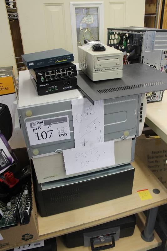 lot 107 image: Electronics Parts Lot Including Computer Desktop, Switch, Hub, Power Supply, HP SureStore Tape 6000