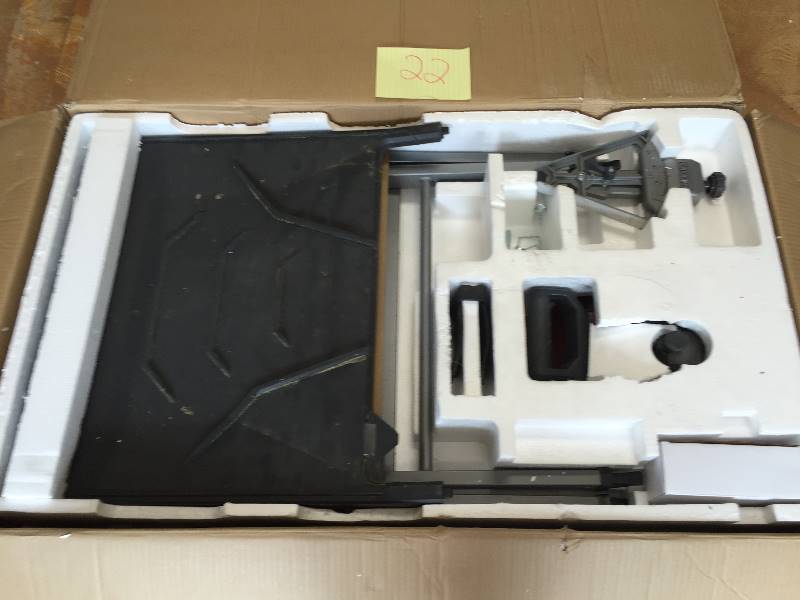 lot 22 image: Ridgid 8 in. Tile Saw with Stand Model # R4040S  in like new conditions