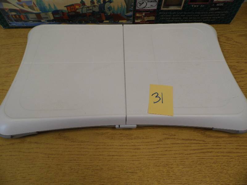 lot 31 image: Wii Fit Board & Christmas Train