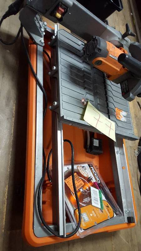 lot 77 image: Ridgid 7 Tile Saw- missing stand and guard see pictures in working condition