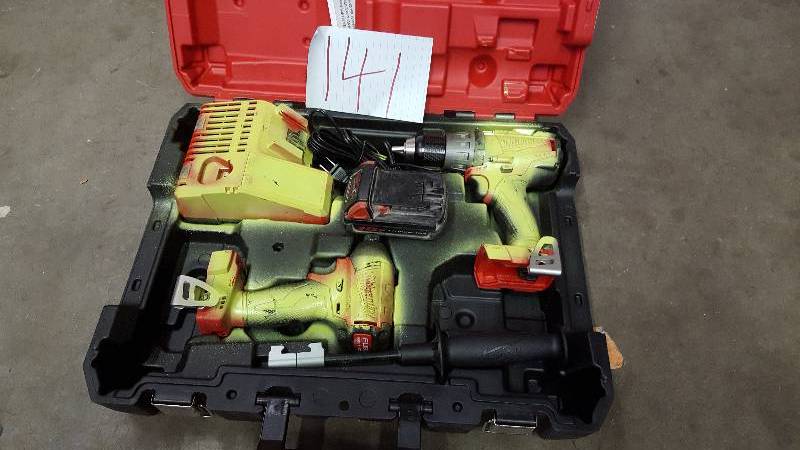 lot 141 image: Milwaukee M18  Fuel Hammer Drill driver and impact driver - used in working condition paitend in one side one battery and charger included