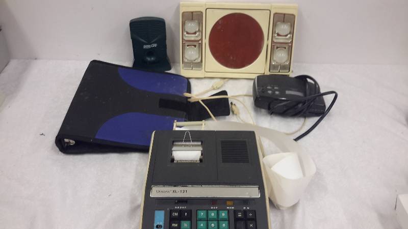 Vanity mirror, clock radio, adding machine, binder,