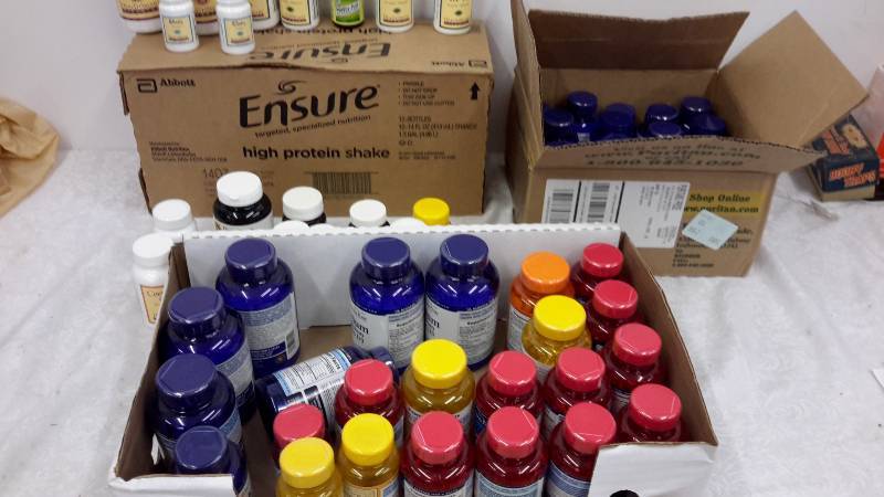 Large lot of vitamins and case of Ensure