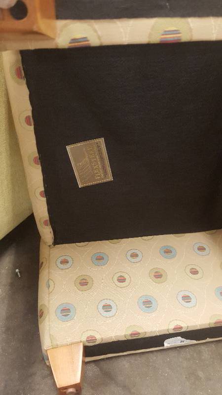 lot 6 image: Arm Chair with Roll under Ottoman. By Flexsteel. Cool and Unique design.